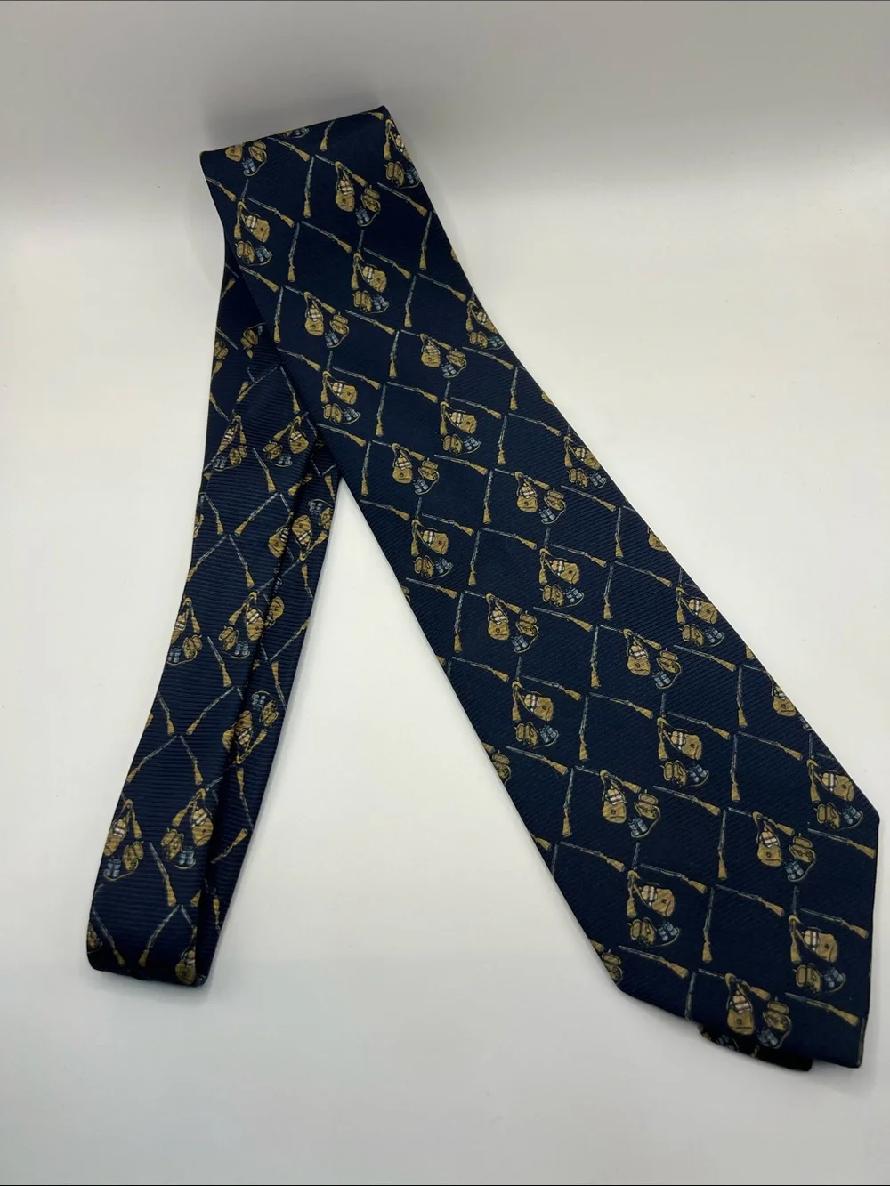 502. Burberrys Navy Tie with Gold Crest Pattern